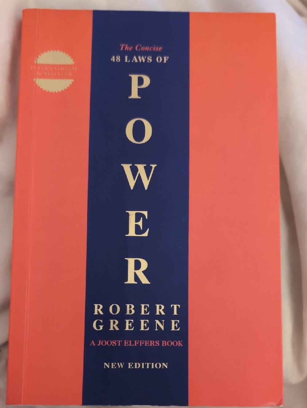 The Concise 48 Laws of Power by Robert Greene - Coral & Navy Cover